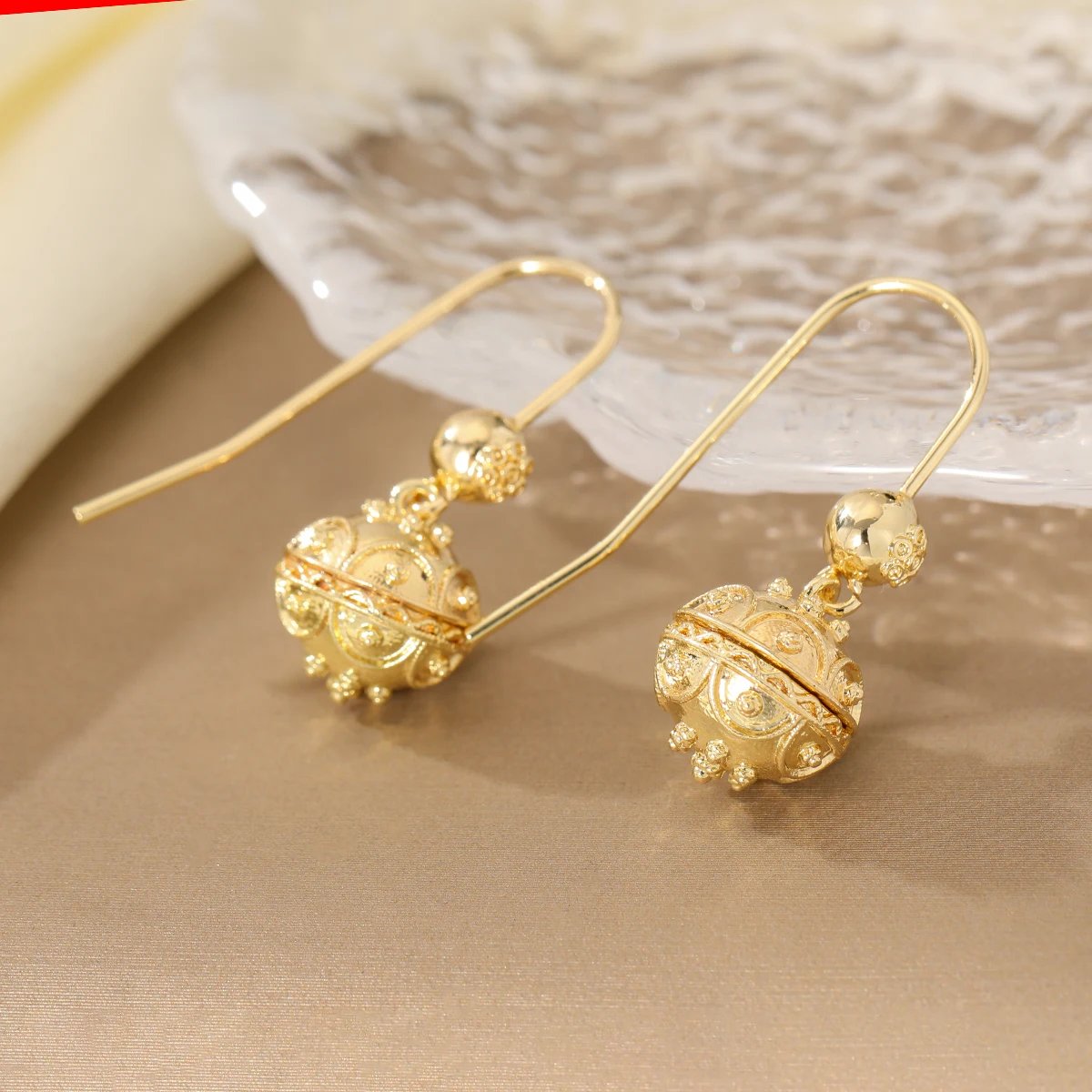 Elegant and minimalist style polished carved ball copper women's drop earrings suitable for party and date matching. Elegant and minimalist style polished carved ball copper women's drop earrings suitable for party and date matching.