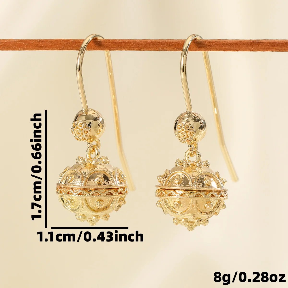 Elegant and minimalist style polished carved ball copper women's drop earrings suitable for party and date matching. Elegant and minimalist style polished carved ball copper women's drop earrings suitable for party and date matching.
